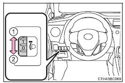 Botão de ajuste manual do nível dos faróis (veículos com faróis de halogéneo)