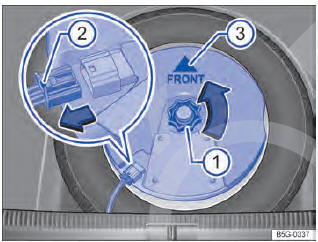 Fig. 250 No compartimento de bagagem: Remover o subwoofer (variante 2).